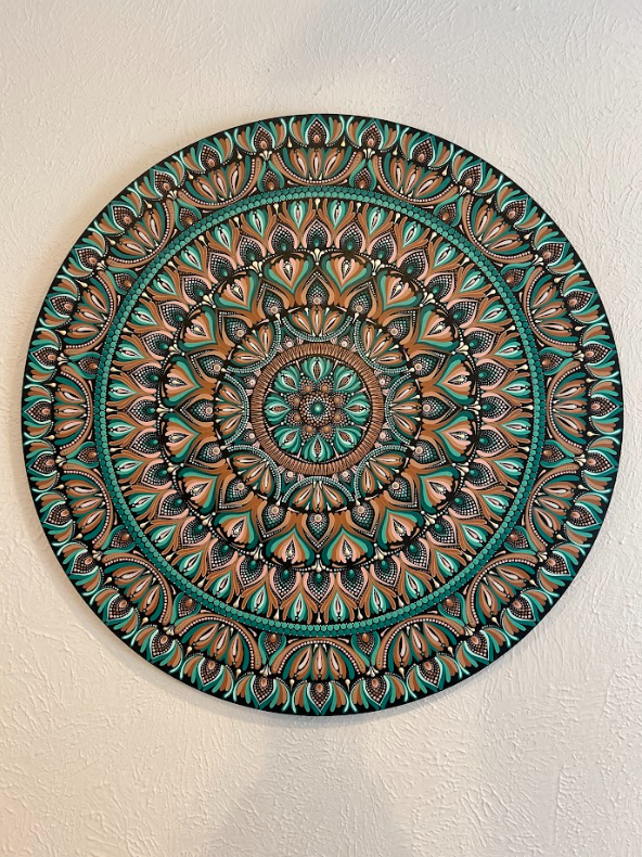 Cream and teal handmade mandala wall art painted on a birch round