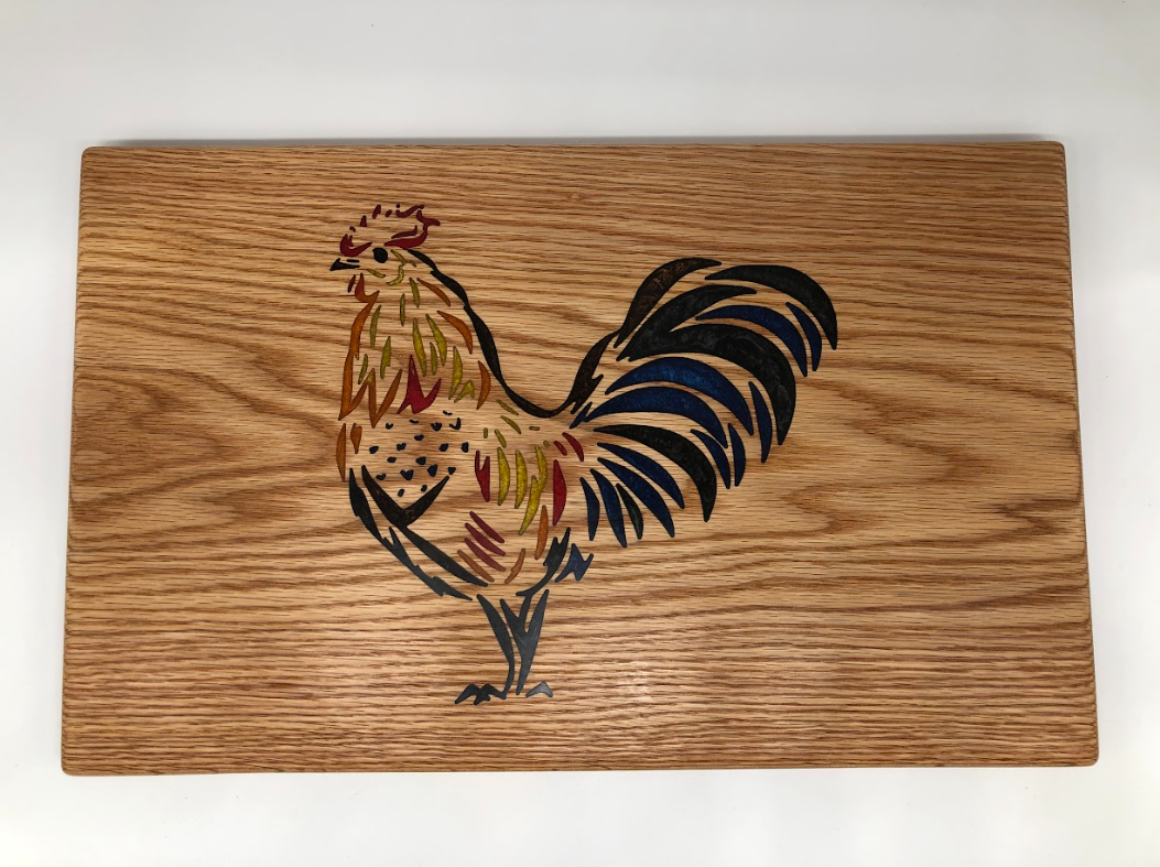 Chicken-themed handmade charcuterie board with custom artistic detail