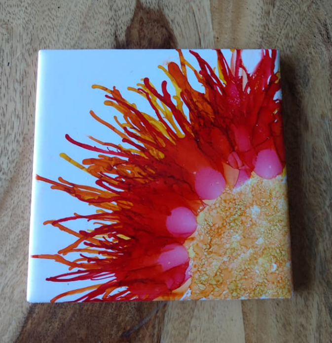 Hand-painted coaster with colorful handmade artwork