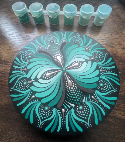 Handmade mandala art piece with detailed pattern
