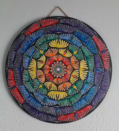 Handmade mandala wall art with layered colorful design