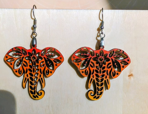 Orange elephant earrings laser cut with precise detail